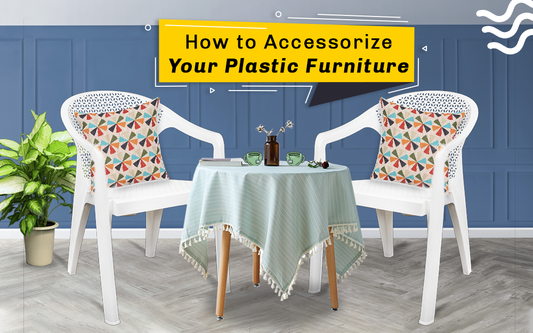 How to Accessorize Your Plastic Furniture!" - Image of a plastic patio set with colorful accessories. The table is decorated with a bright tablecloth, a vase of flowers, and candles. The chairs have patterned cushions and throws. 